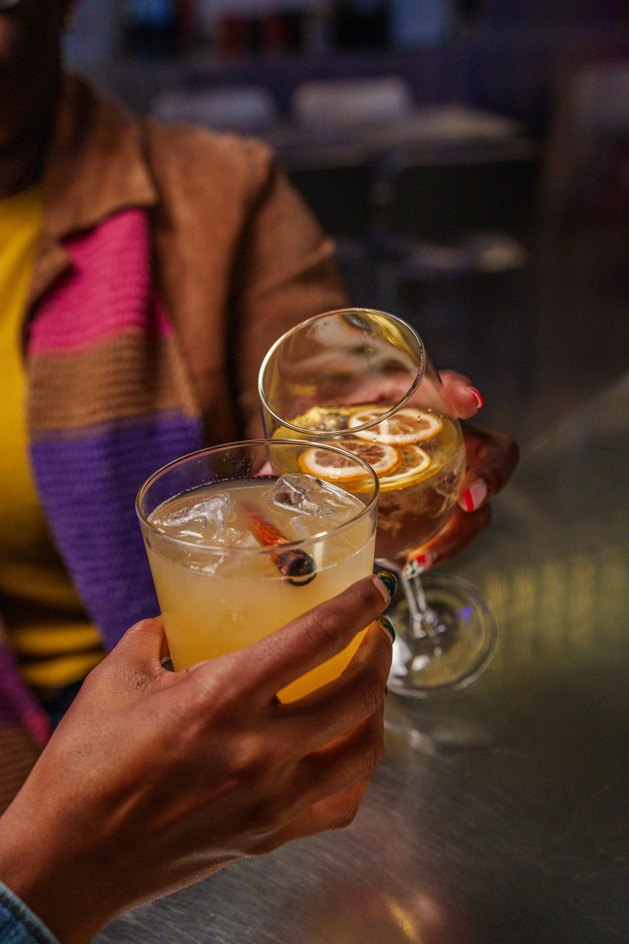 Guests clinking cocktails at Return to Sender